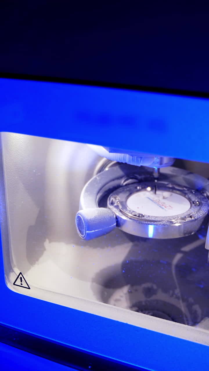 Advanced automated dental milling machine. Dental milling machine carving out shape of human teeth