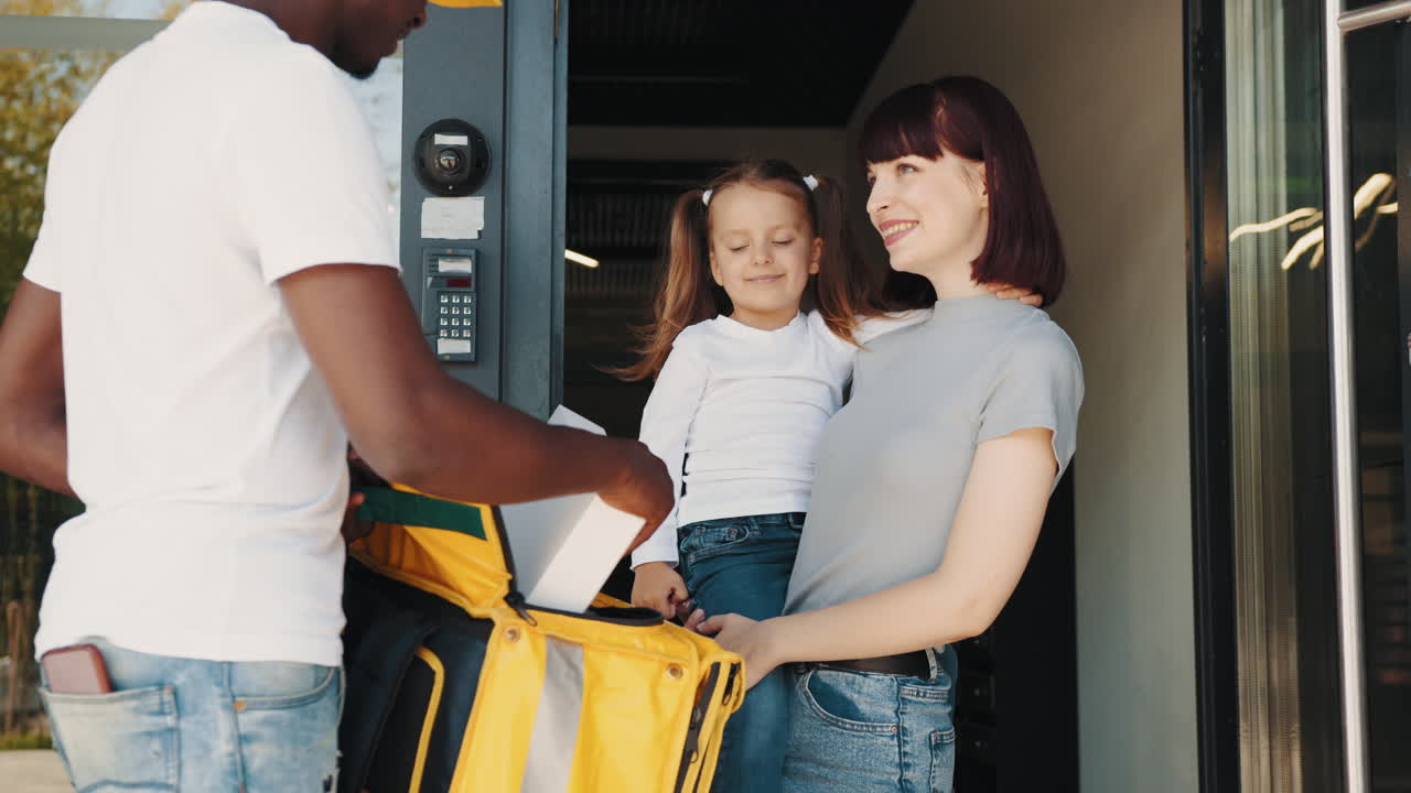 Family Receiving Food Delivery at Home