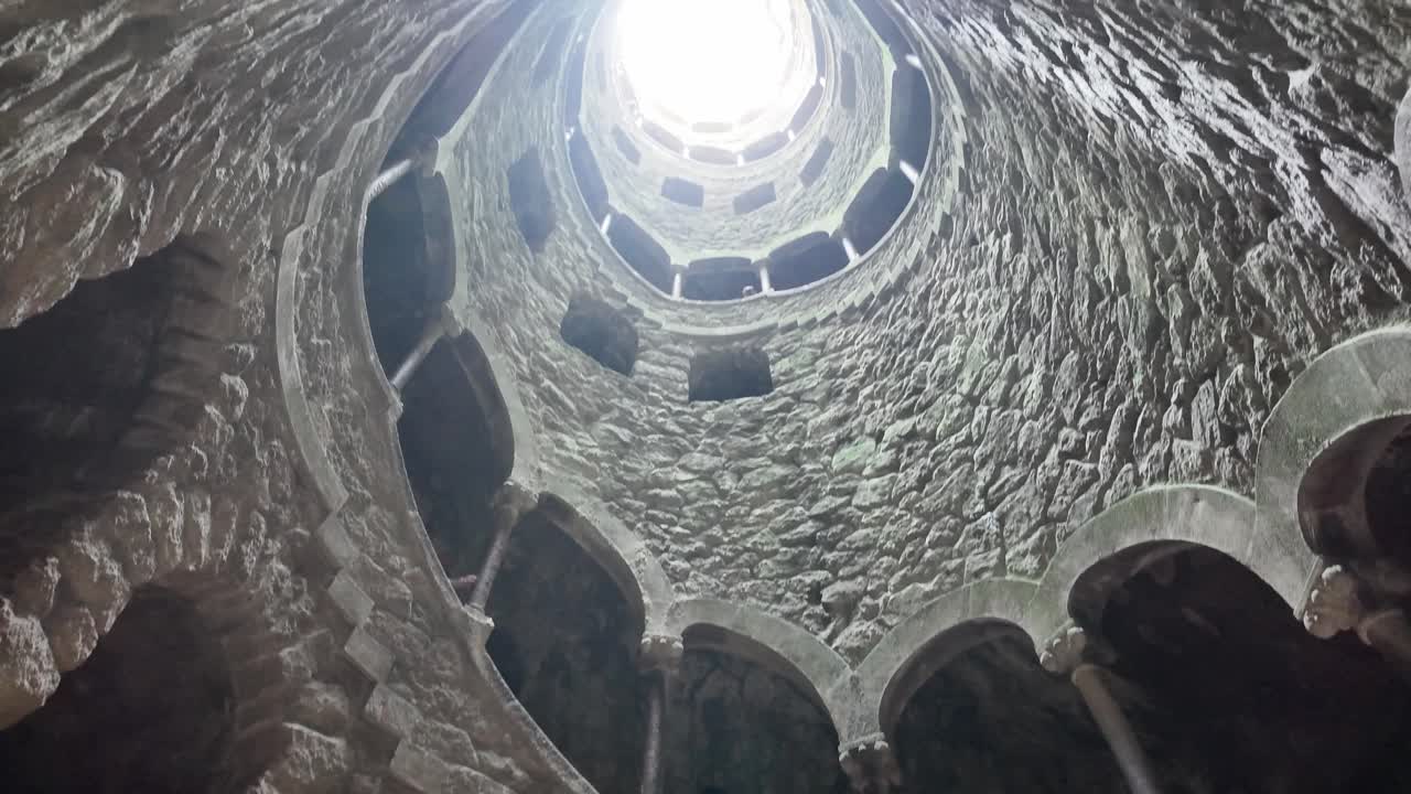 Circular stone mosaic in Quinta da Regaleira, Sintra, Portugal, showcasing intricate geometric patterns