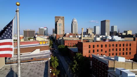 american flag flyby toward louisville kentucky skyline