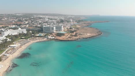 clear blue sea water at nissi beach - aerial view