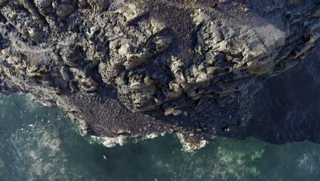 Aerial View of a Rocky Coastline with a Coastal Path