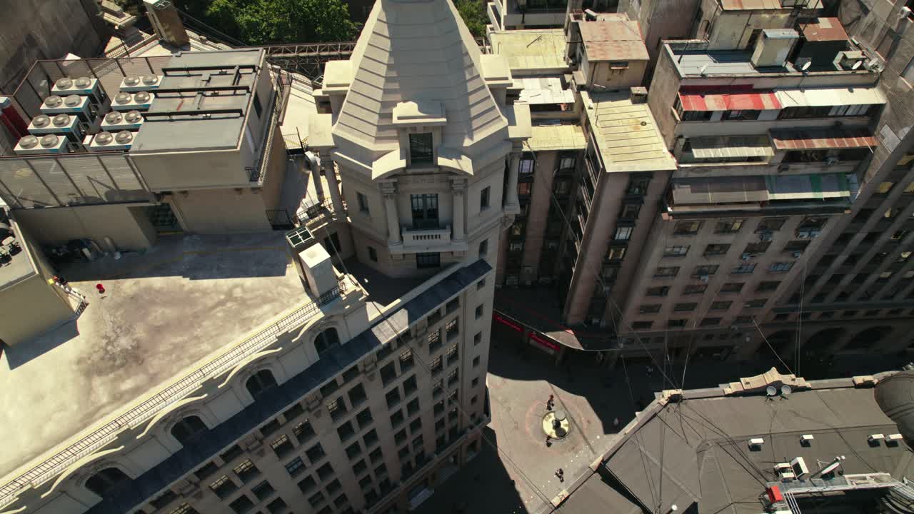 Fly over the Arizt&iacute;a building, the first skyscraper in Santiago Chile, on New York Street, a cobblestone street
