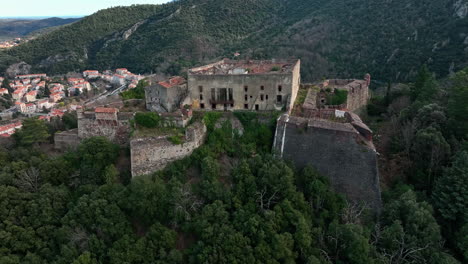 soaring over amélie-les-bains, revealing the city's ancient defensive walls.