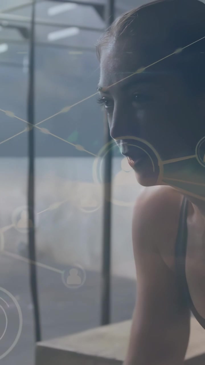 Mid-adult woman reaching forward, repeating push for fitness in studio, HUD nodes aligning with arm