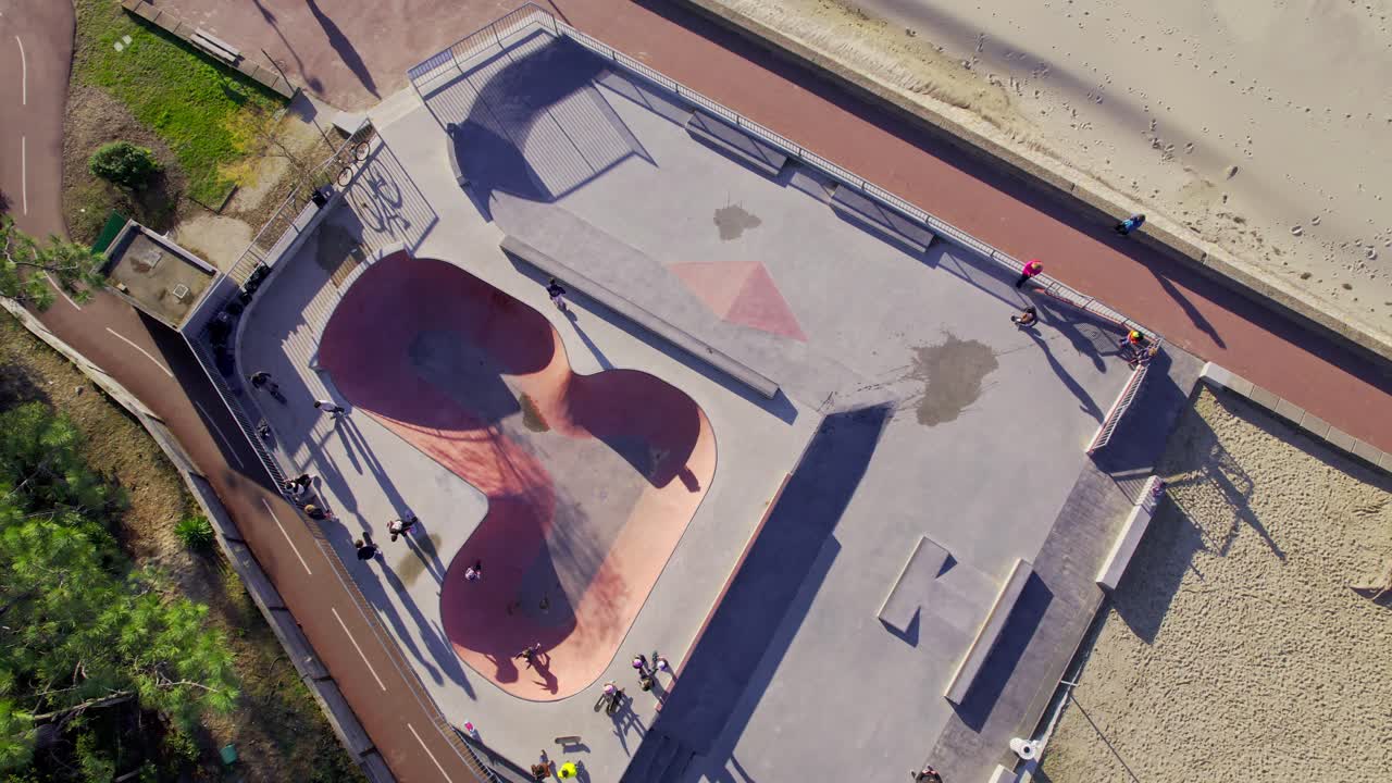 Urban scene with unrecognizable people skateboarding on lane