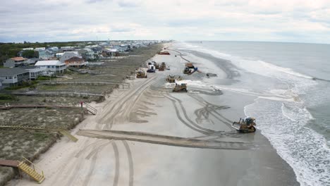 Bulldozers-Empujando-Arena-En-La-Playa-En-Un-Proyecto-De-Restauración-De-La-Erosión-De-La-Playa-Desde-Un-Dron-Aéreo-De-4k