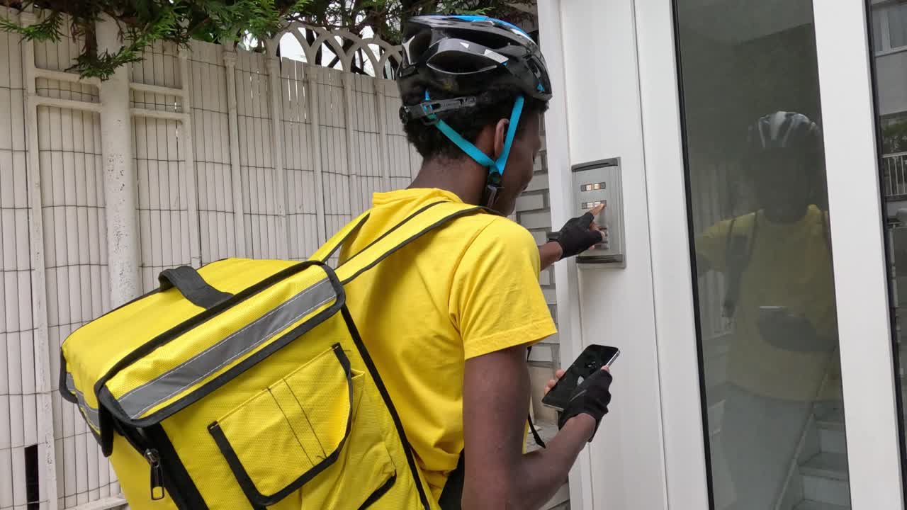 Delivery person ringing doorbell