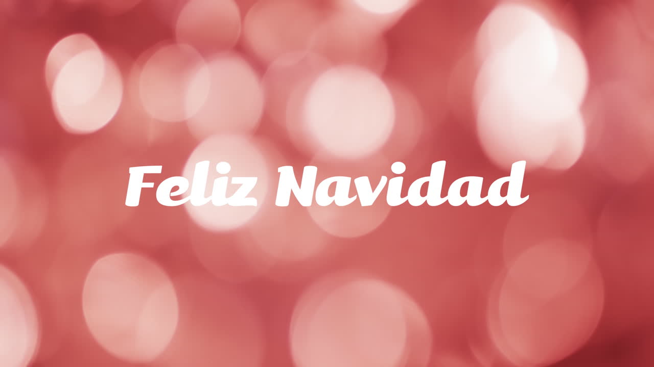 animación del texto de feliz navidad sobre manchas rojas de fondo claro
