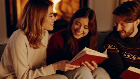 friends and family relaxing at home by the fireplace