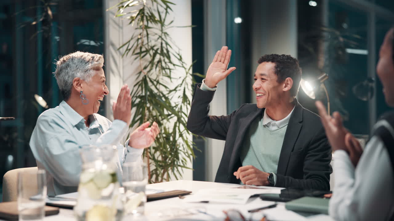 Business Team Celebrating Success in Office