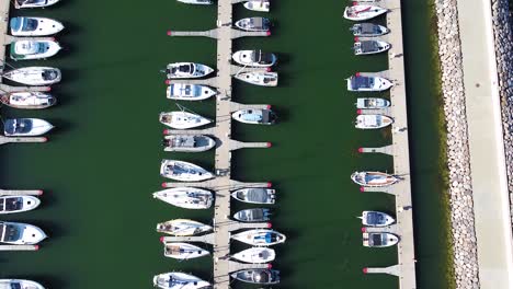 private yachts moored in haven kakumae, aerial top down view