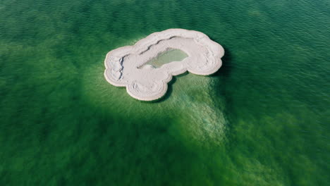 isolated salt formations in the middle of dead sea in israel