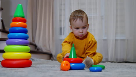 baby playing with stacking rings