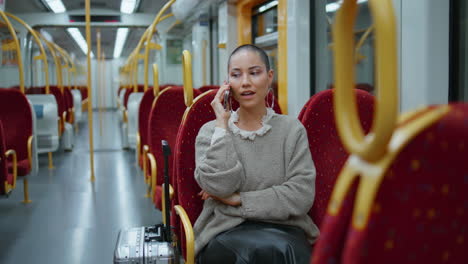 woman talking on phone on subway