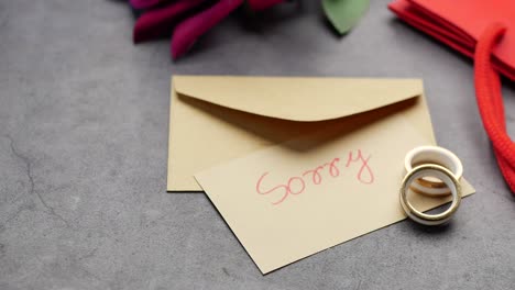 sorry note and rings