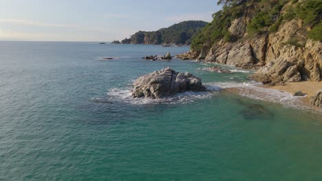 mediterranean beach paradisiaca turquoise blue waters no people aerial view drone spain catalunya costa brava blanes lloret de mar mallorca balearic islands