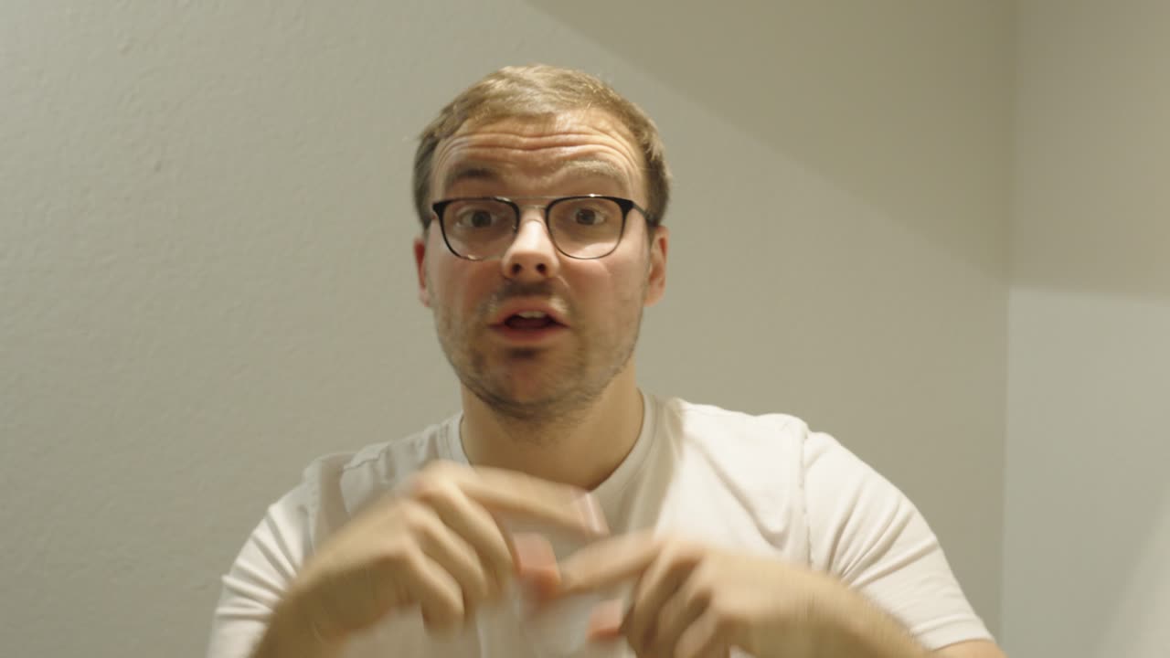 A man speaks energetically using exaggerated hand gestures — concept of nervousness, presentation mistakes, or expressive communication style