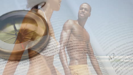 animation of book and compass over african american couple on beach