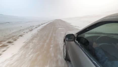 driving over song kol lake in the middle of winter with a blizzard and freezing conditions