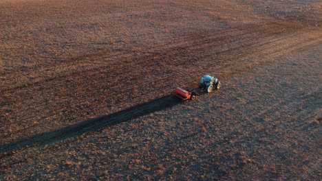 tractor planting seeds in a field