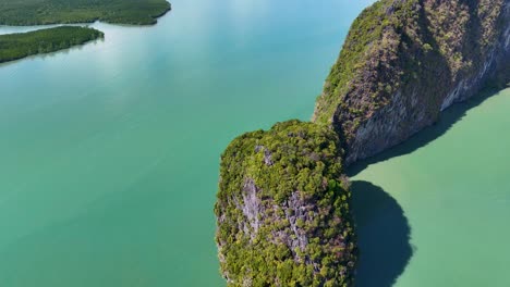 drone footage captures lush islands and turquoise waters in phang nga bay, thailand, showcasing stunning natural beauty and serene landscapes