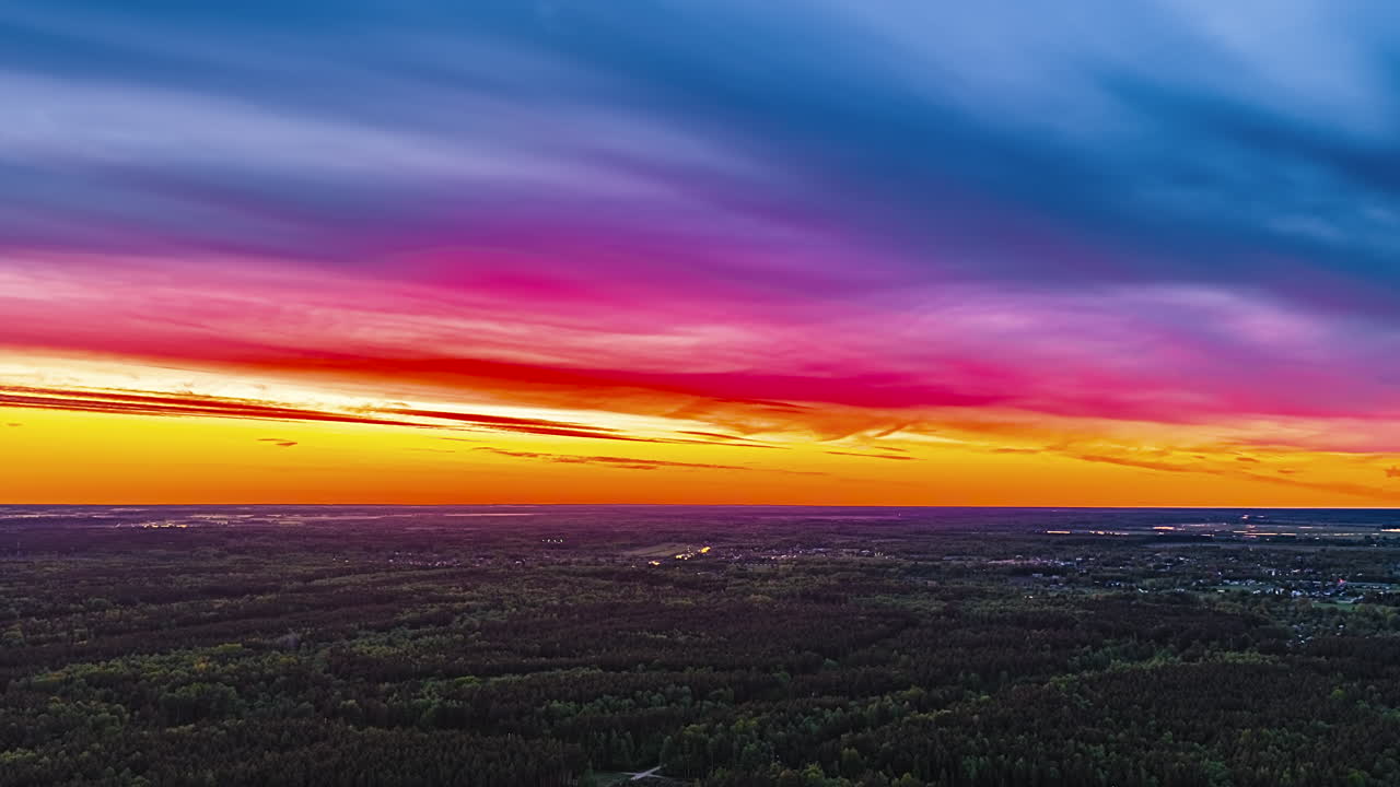 Colorful sunset sky drone hyperlapse with dramatic clouds and vibrant gradient