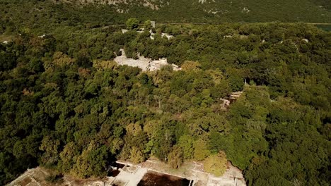 Drone-view-of-Butrint-acheological-site,-Albania,-Europe-Dolly-towards-castle