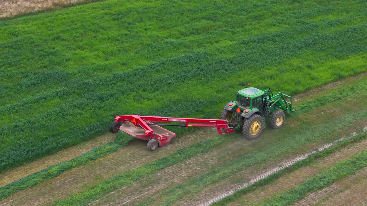Farmers' Precision: Aerial Overlook of a Green Tractor on a Circular Field in British Columbia