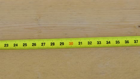 shot of a measuring tape from left to right, from 0 to 70