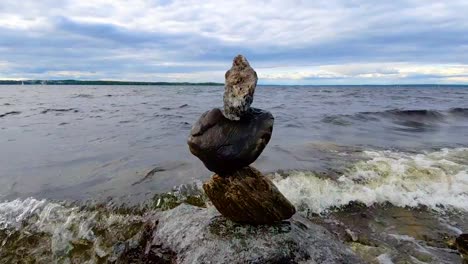 pile of stacked rocks on the shore of lake näsijärvi in tampere finland