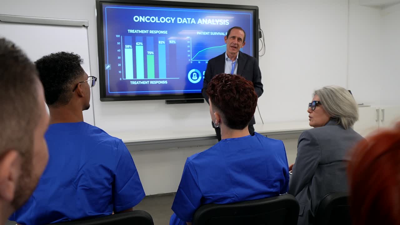 Male Presenter Explaining Oncology Data Analysis to Medical Professionals