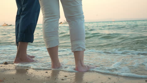 barefoot man and woman on the beach