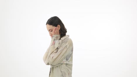 young woman expressing distress or contemplation on white background