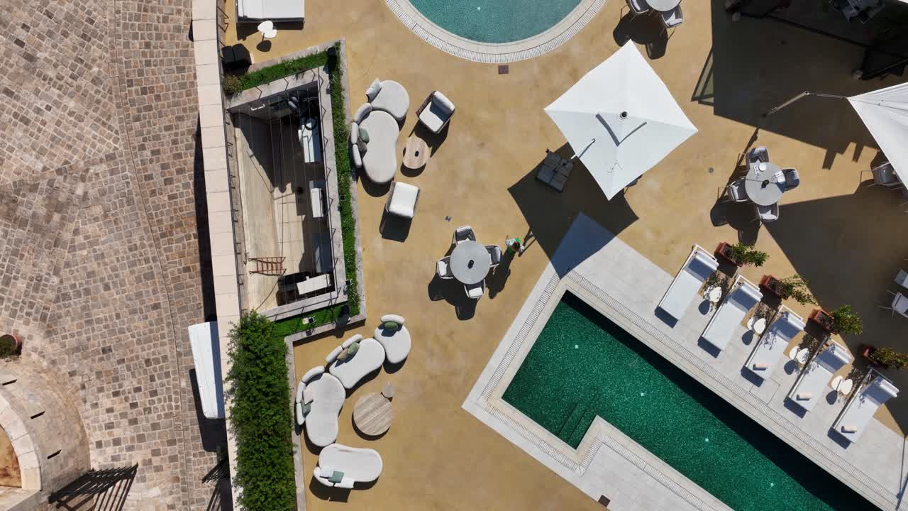 Luxury poolside lounge with elegant sunbeds and bar on sunny Mamula Island resort