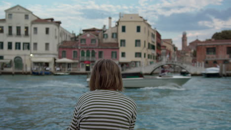 teenager overlooking venice canal view