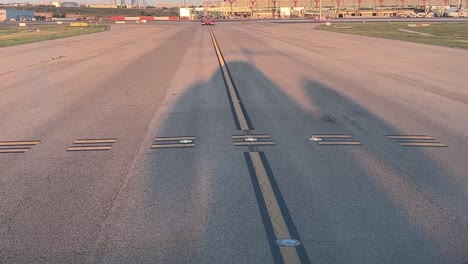 the shadow of a medium size jet as seen by the pilots from the cockpit during the taxi in to madrid airport early in the morning