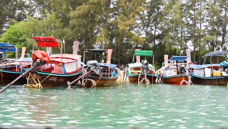 colorful boats docked along krabi's scenic shoreline