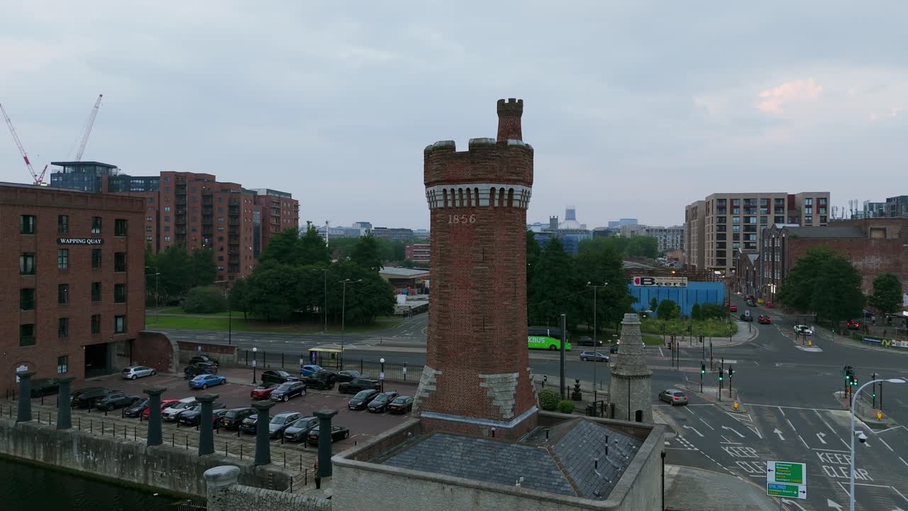 Wapping Dock and brick tower, Liverpool, UK. Aerial drone orbiting