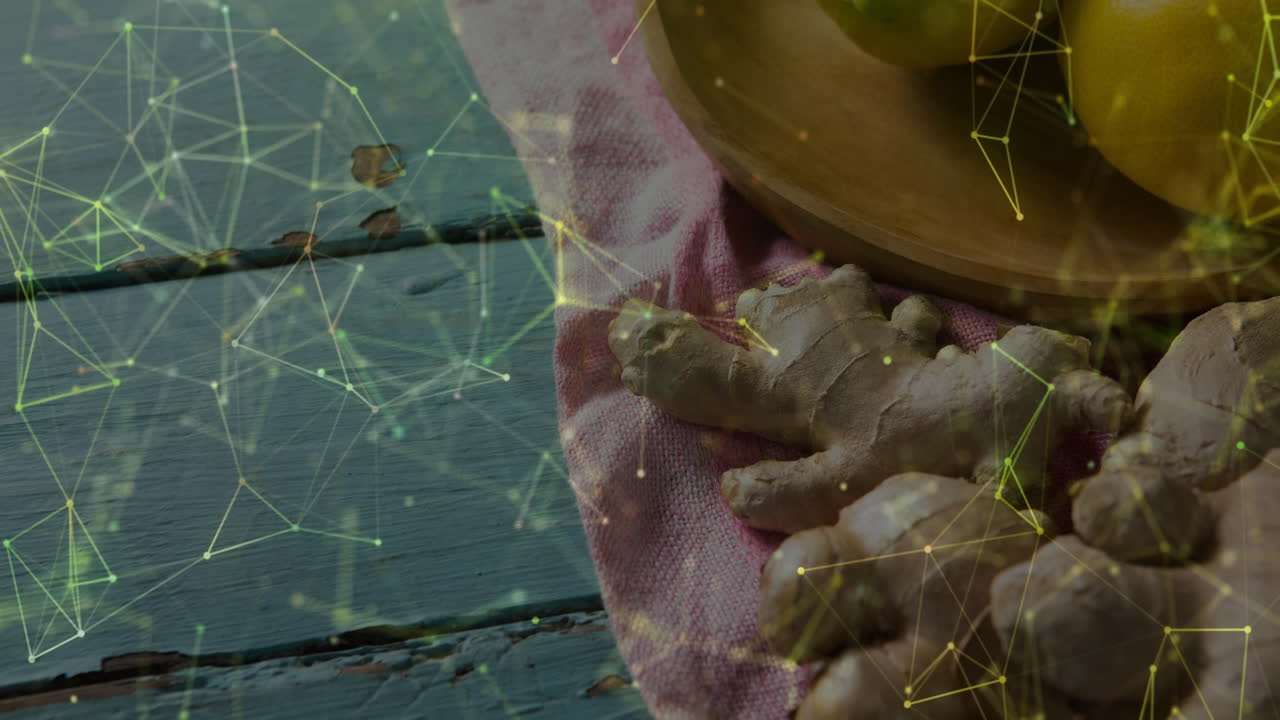 Visualizing kitchen tabletop displaying fresh ginger roots and lemons under digital network overlay