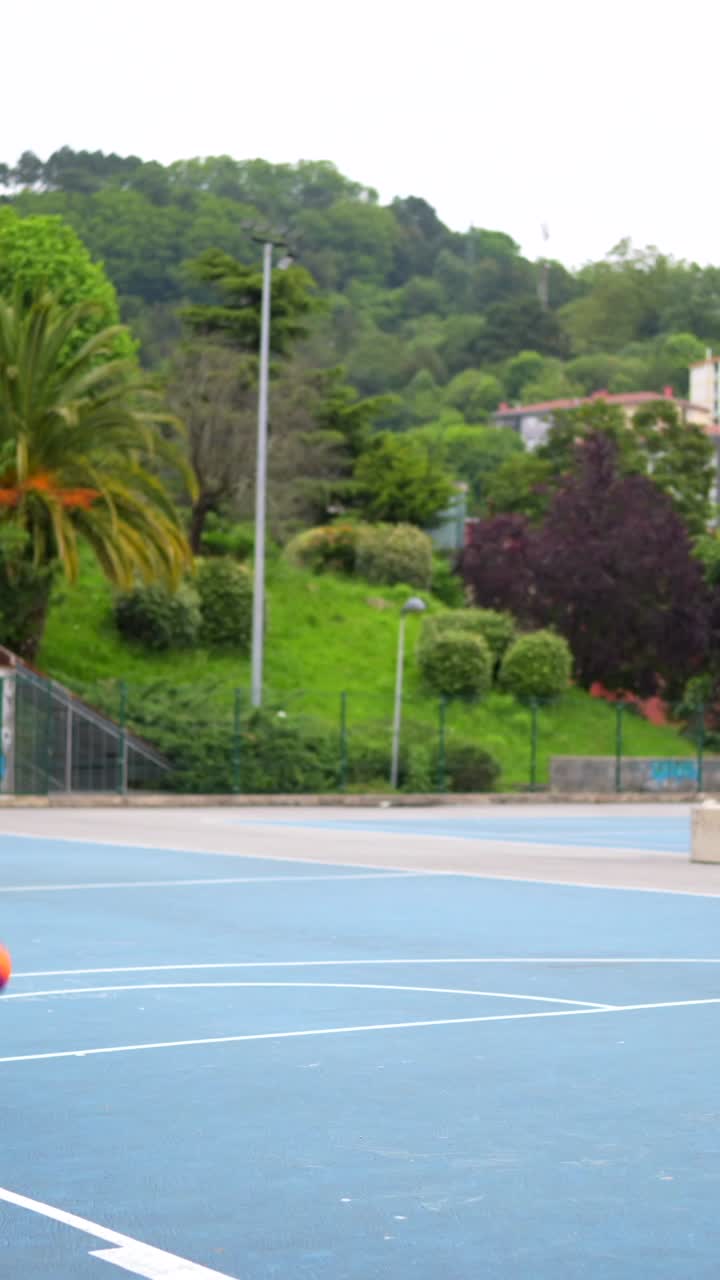 Playing basketball outdoors