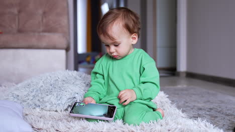 baby playing with a phone