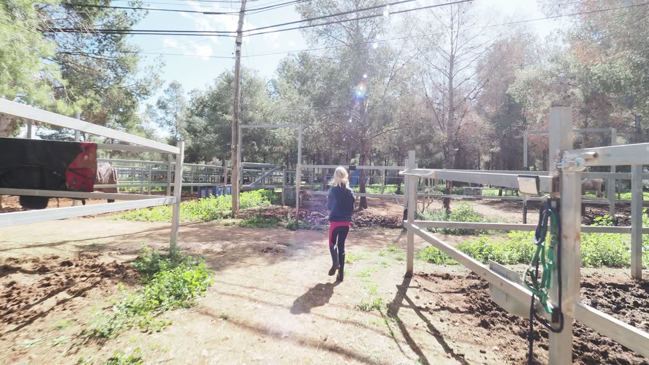 Girl at a horse stable