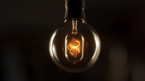 close-up of a vintage edison light bulb glowing