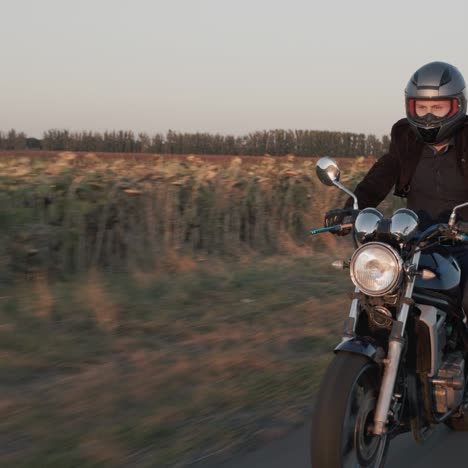 Me-rides-a-motorcycle-on-a-country-road-2