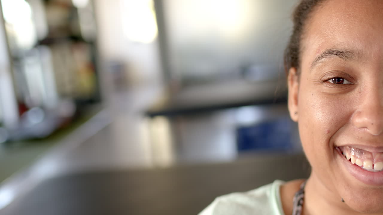 In rehabilitation center, woman smiling and focusing on positive progress, copy space
