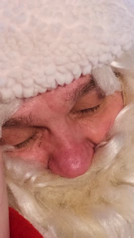 A Santa Claus Figure Evokes Holiday Magic and Joy in a Video this Heartwarming Video Showcases Santa Claus Evoking Holiday Magic with Closed Eyes he Embodies Warmth and Joy Inviting Viewers into Christmas Spirit