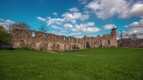 Timelapse-white-clouds-cast-shadows-on-the-ruins-of-Dobele-Castle-in-Latvia