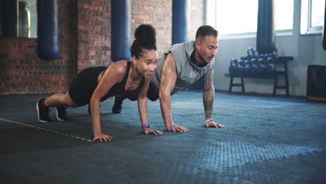 man, woman and push up for gym exercise