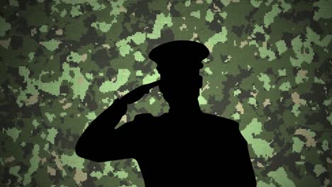 silhouette of soldier saluting against camouflage background